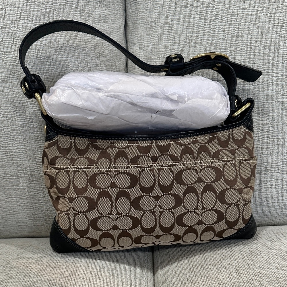 Signature Coach tan/brown bag with gold hardware